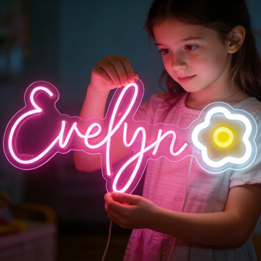 Neonskylt med ett namn och en gul blomma